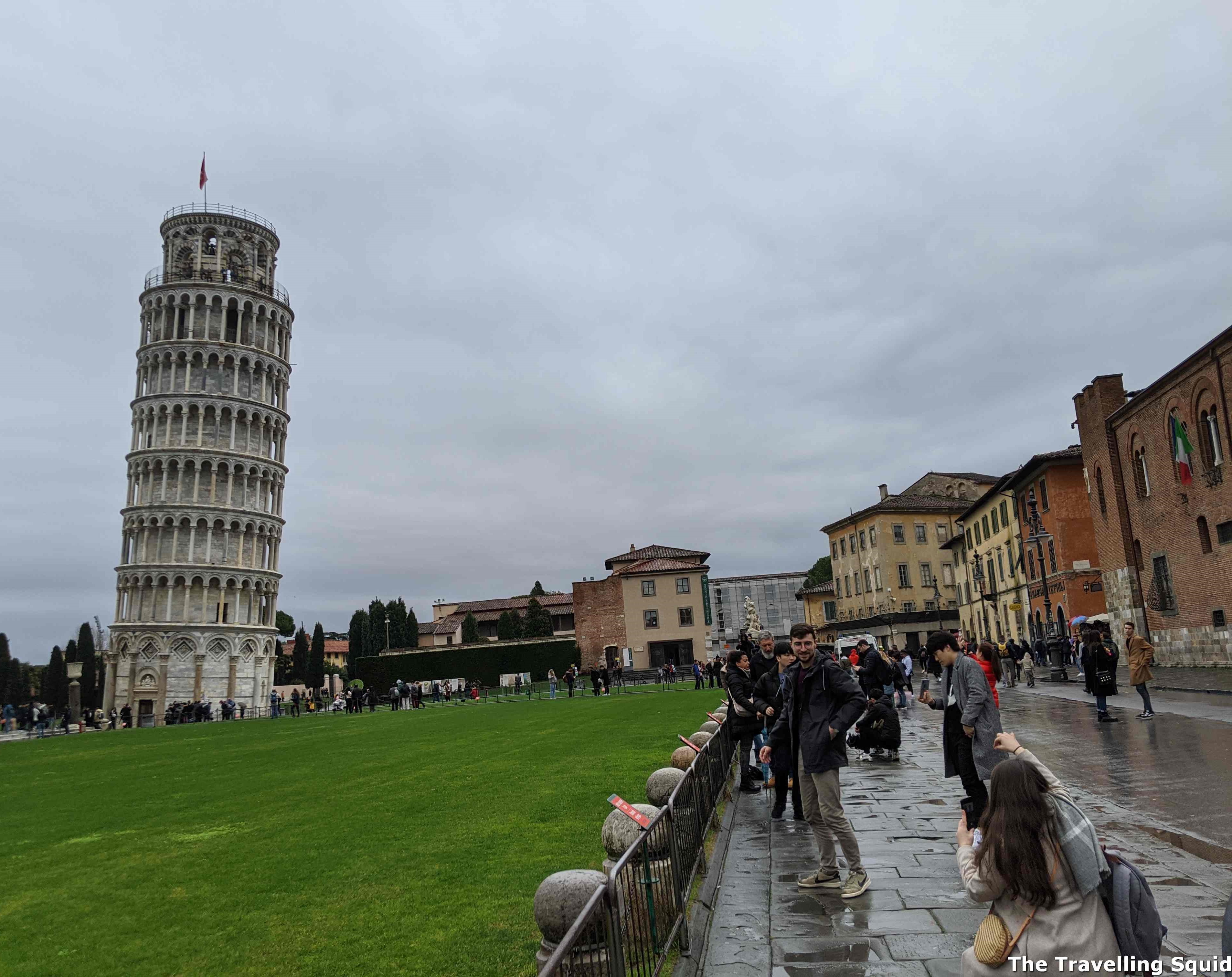 paying to climb up the Leaning Tower of Pisa