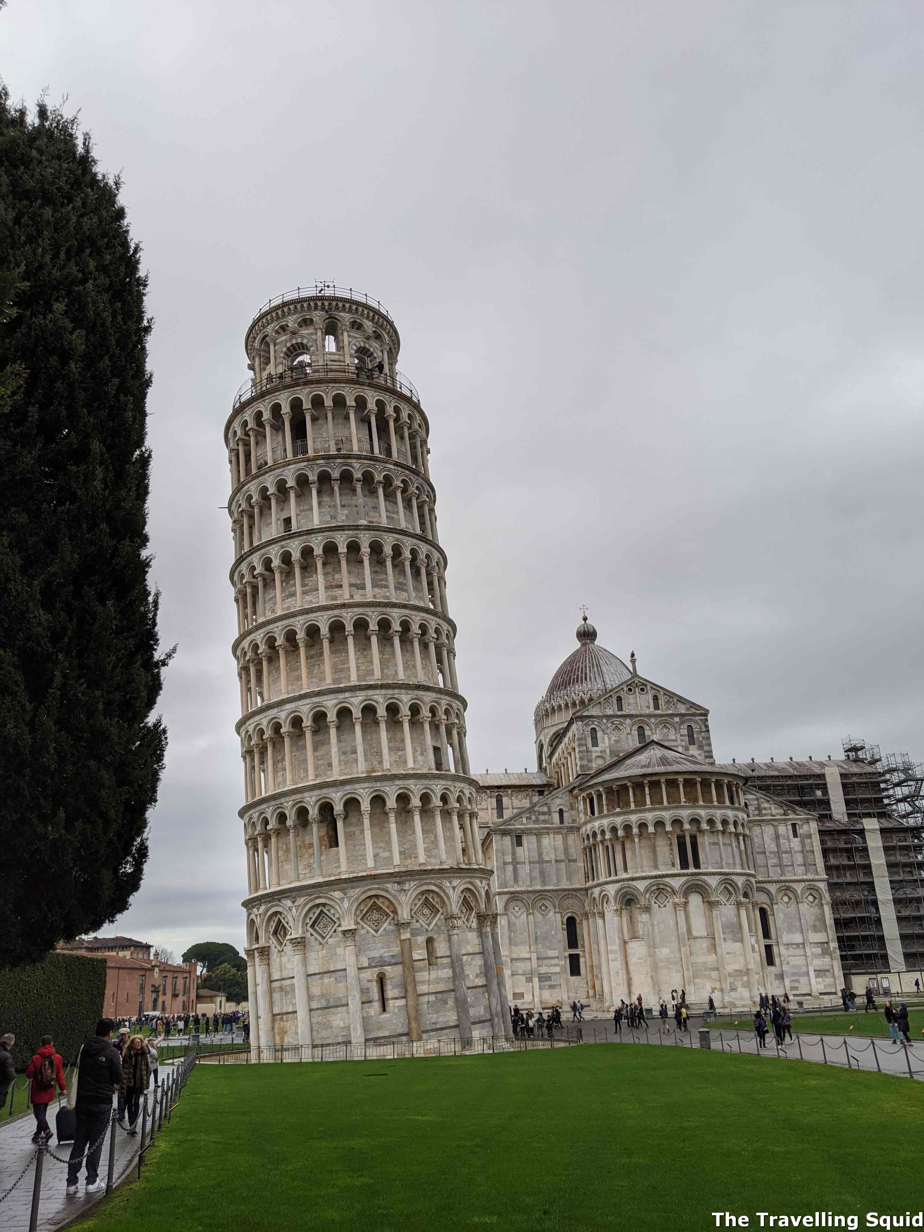 paying to climb up the Leaning Tower of Pisa